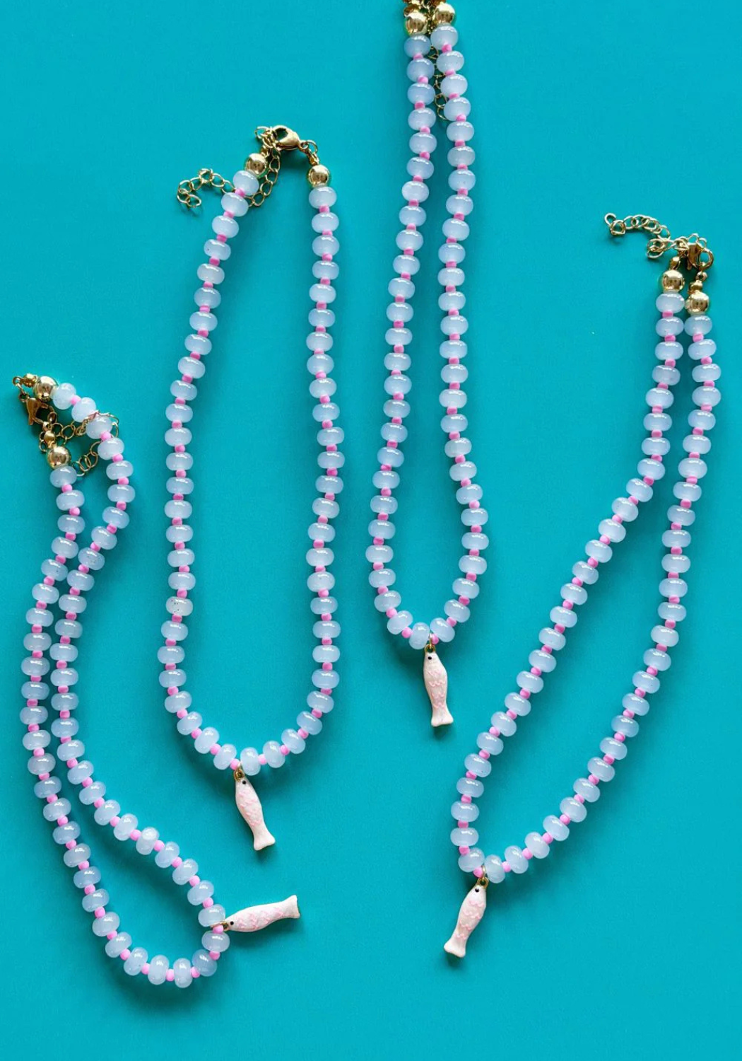 MOSK MELBOURNE WIDDLE FISHY GEM NECKLACE - LIGHT BLUE