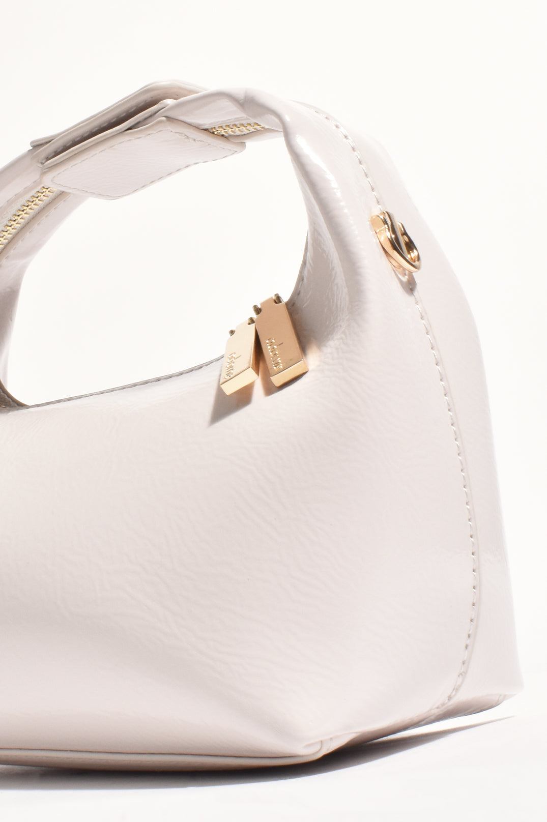 ADORNE LIA PATENT CURVED SMALL BAG - CREAM